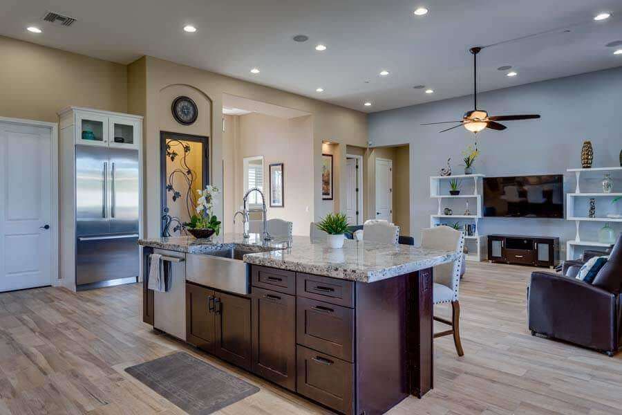 A modern open-concept kitchen with an island and sleek furnishings.
