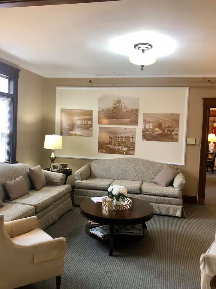 A cozy living room with comfortable sofas and wall art.