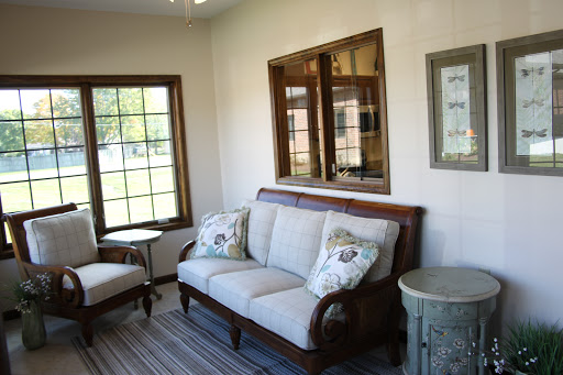 A cozy living room featuring elegant furniture and abundant natural light.