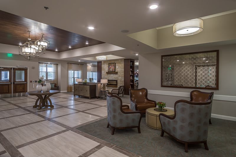 A modern and spacious lobby with comfortable seating areas and elegant lighting.