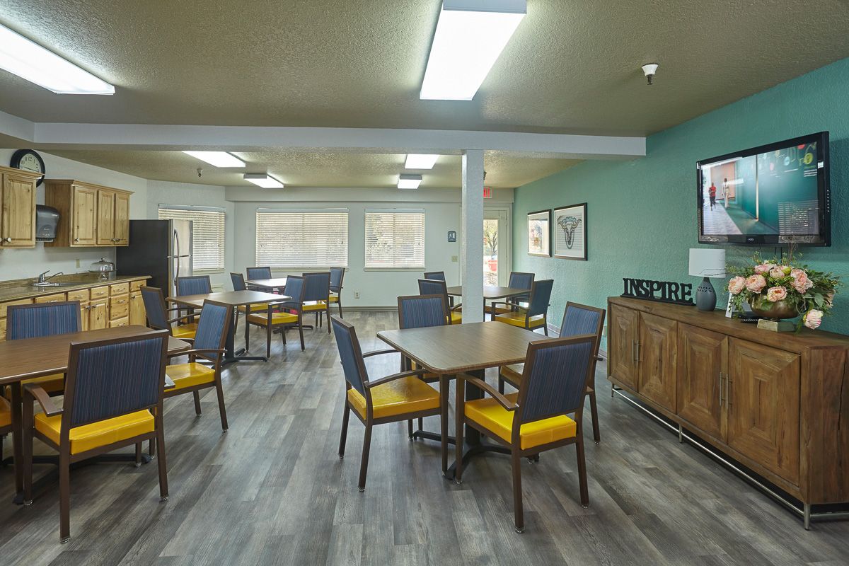 A spacious dining area with modern furnishings and ample seating.