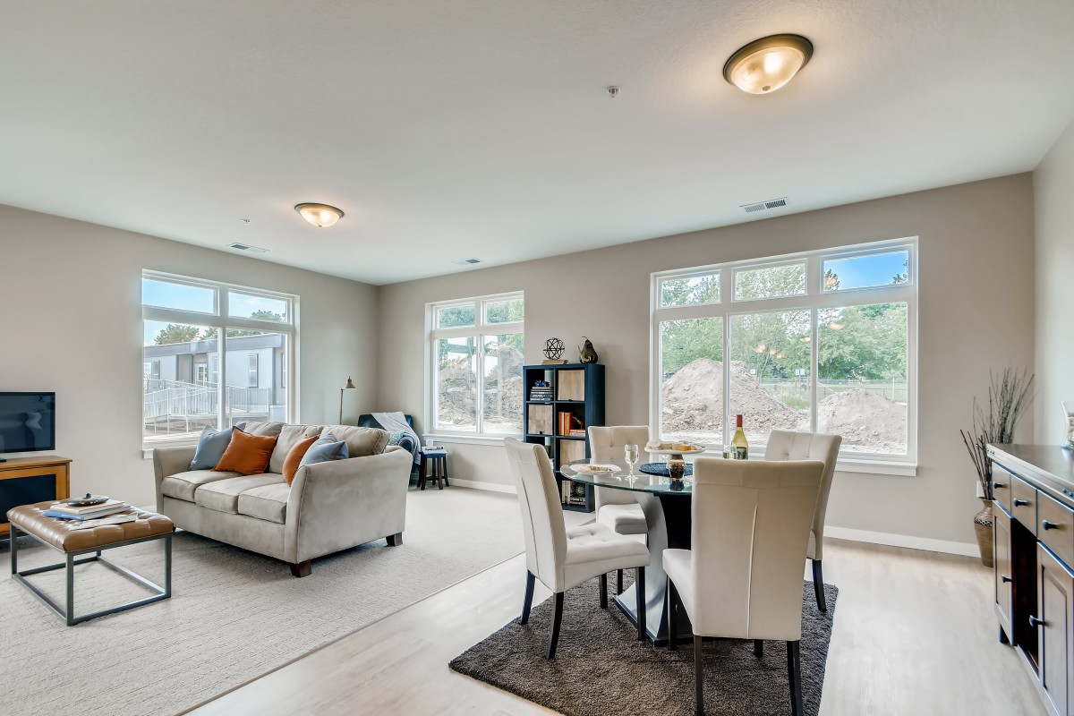 A spacious living and dining area with modern decor and ample natural light.