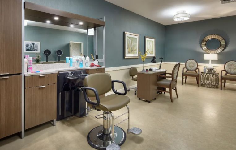 A well-organized beauty salon with styling chairs and grooming stations.
