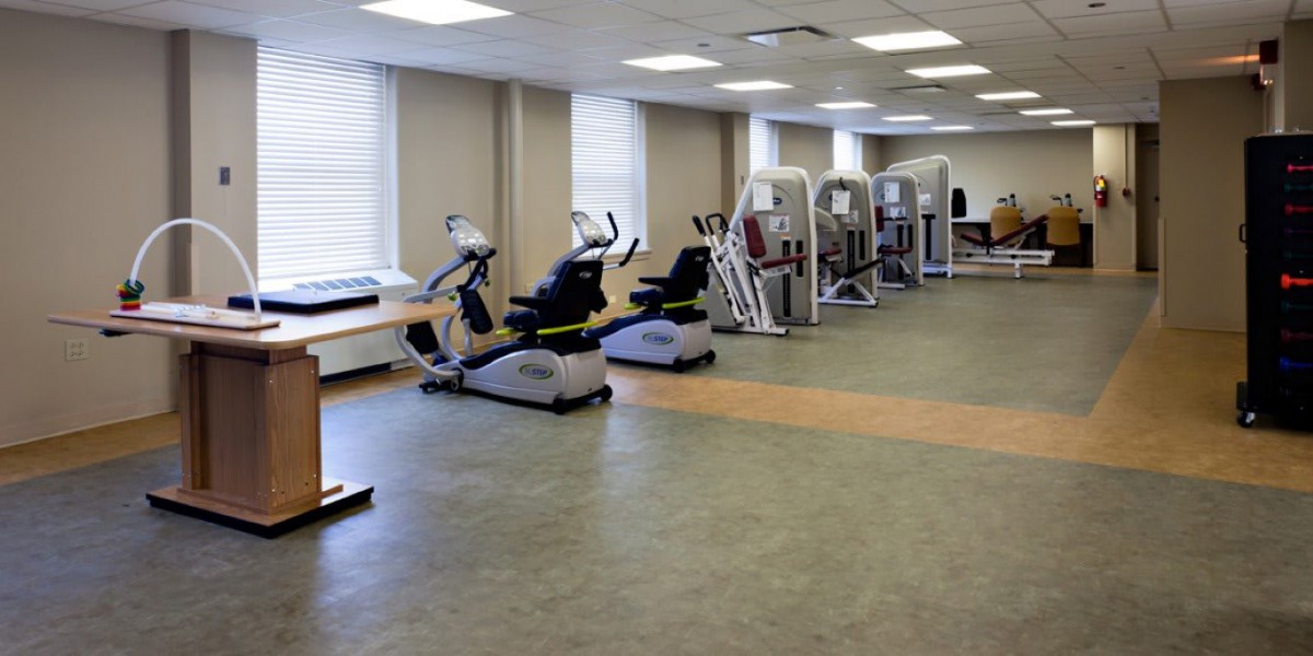 A spacious gym with various exercise equipment and cardio machines.