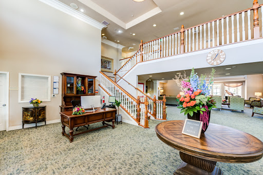 A welcoming reception area featuring elegant decor and a staircase.