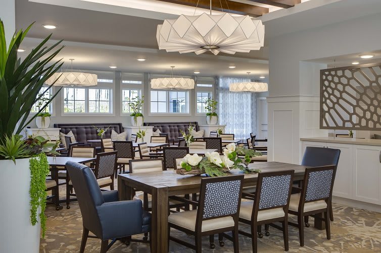 A beautifully decorated dining area with elegant lighting and table settings.