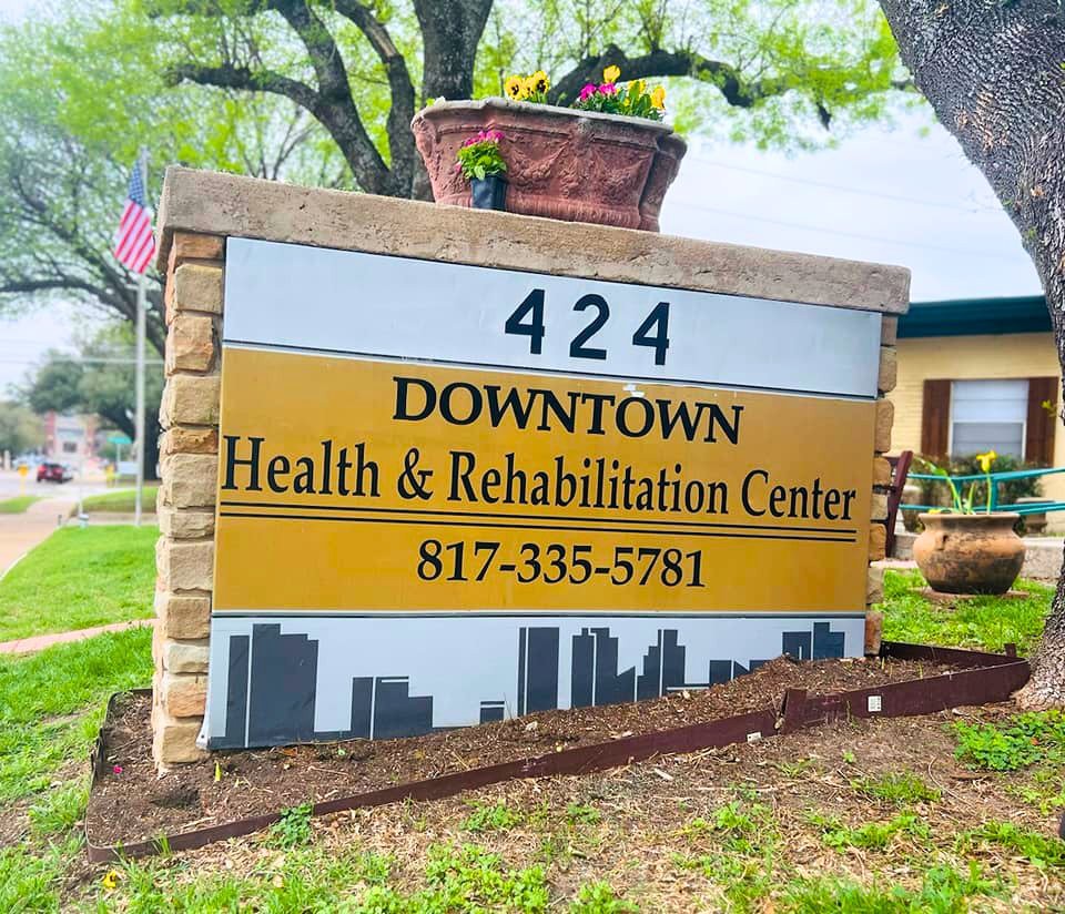 Sign for Downtown Health & Rehabilitation Center with contact number.
