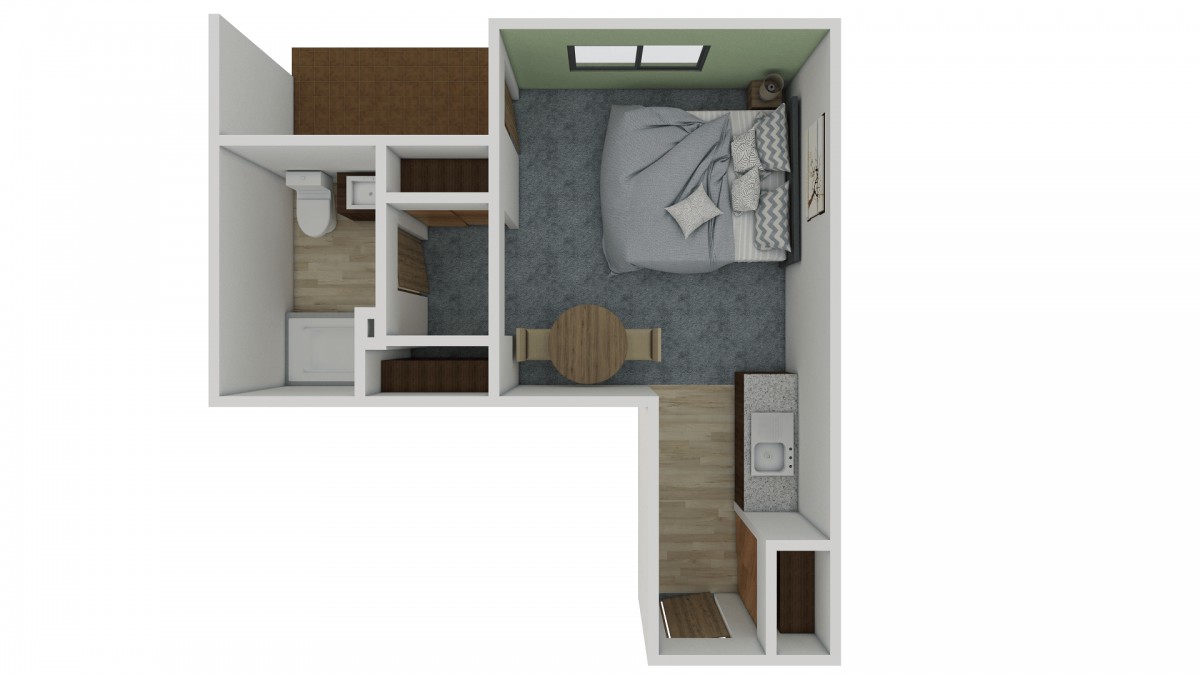 Studio apartment floor plan with designated areas for a bedroom, kitchen, and bathroom.