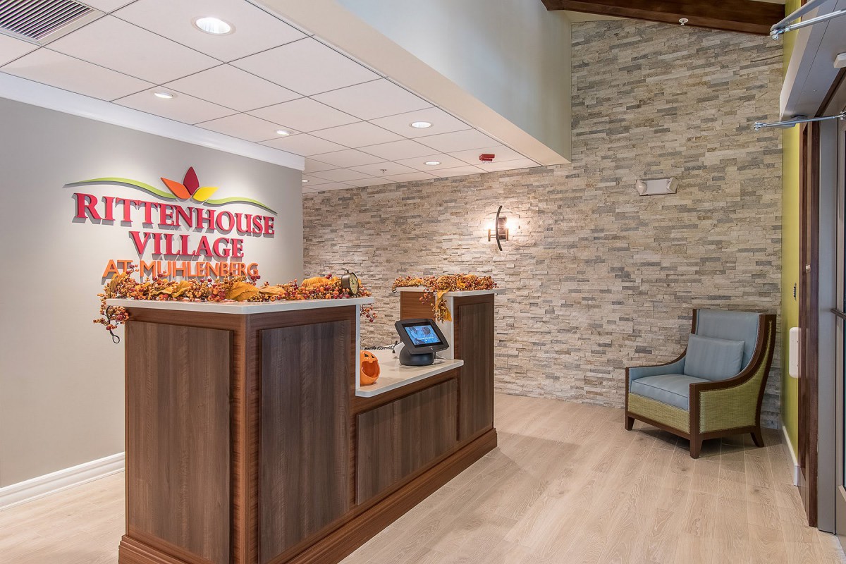 A welcoming reception area with a desk and seating.
