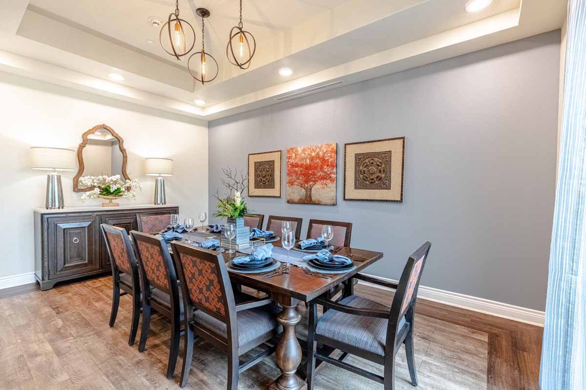 A stylish dining room with elegant furniture and modern decor.