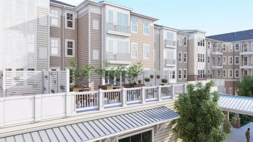 A modern apartment building with spacious balconies and a stylish design.