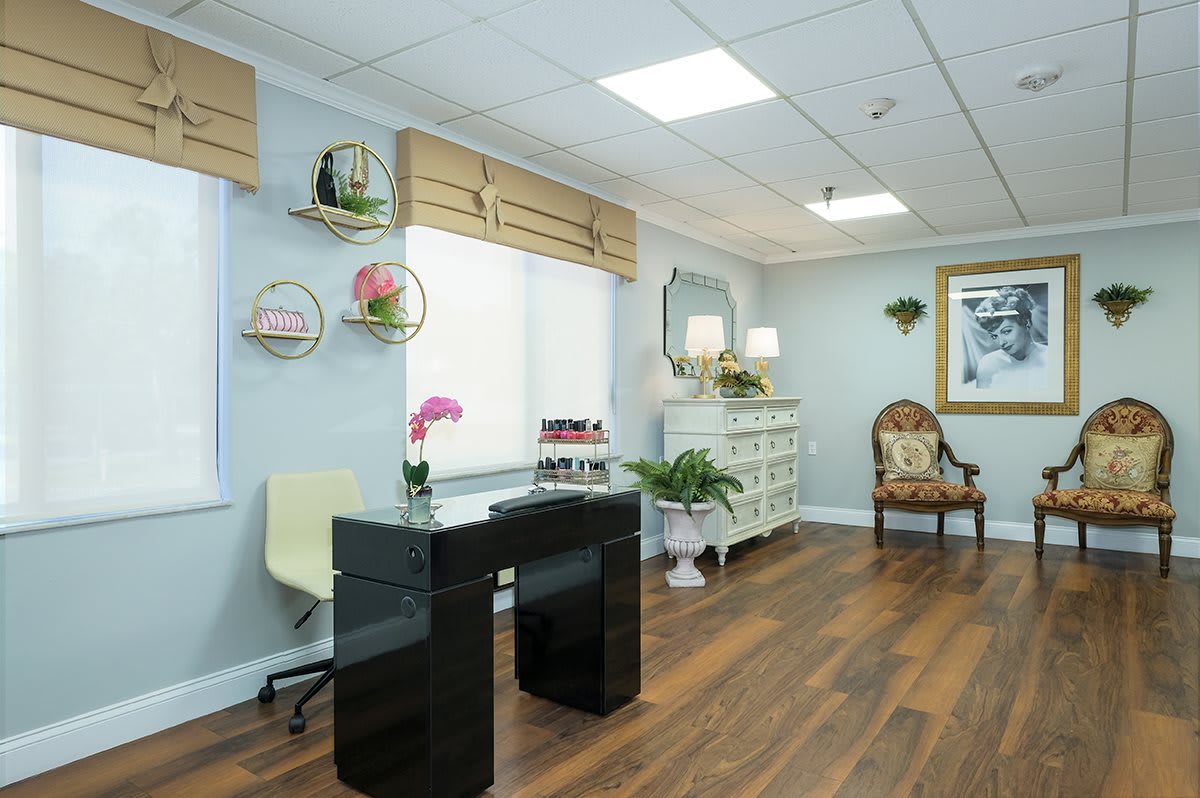 A modern office interior with stylish decor and wooden flooring.