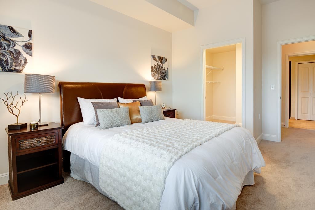 A modern bedroom with a comfortable bed and stylish decor.