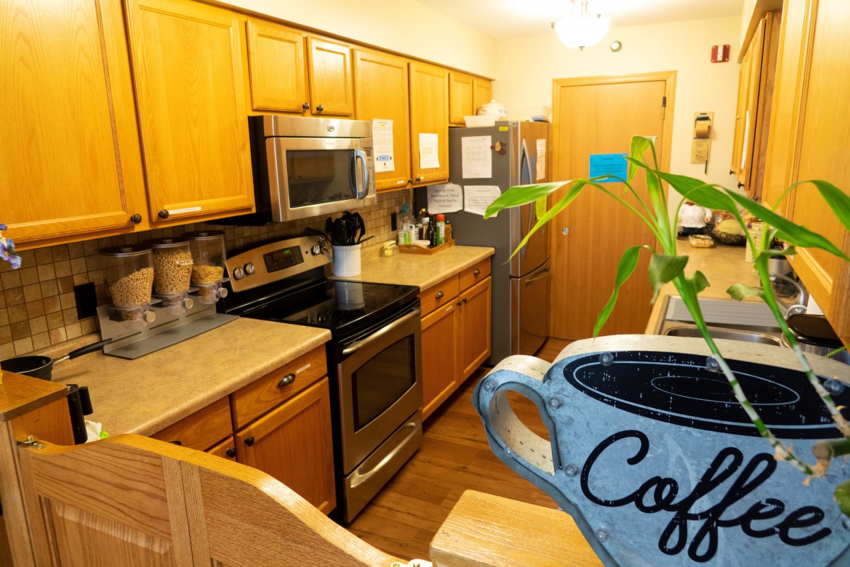 Warm and inviting kitchen space with modern appliances and wooden cabinetry.