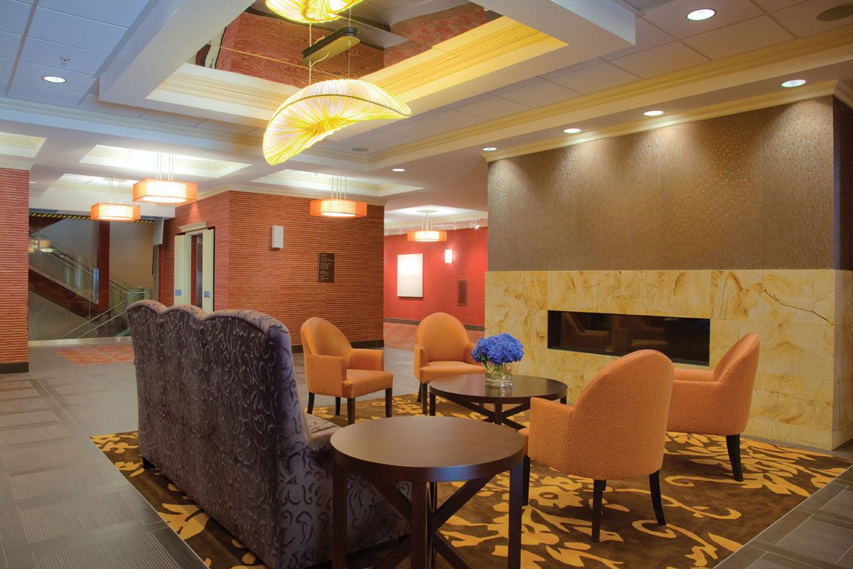 A modern hotel lobby with comfortable seating and stylish lighting.