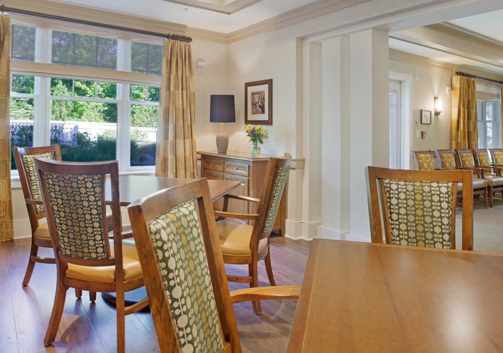 A cozy dining room with wooden furniture and elegant decor.