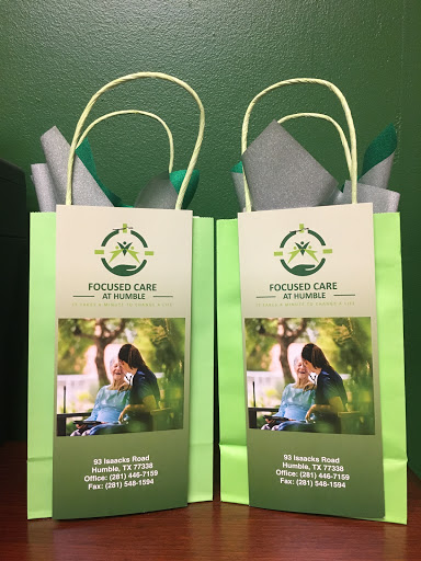 A pair of branded gift bags showcasing a wellness theme, designed for promotional purposes.