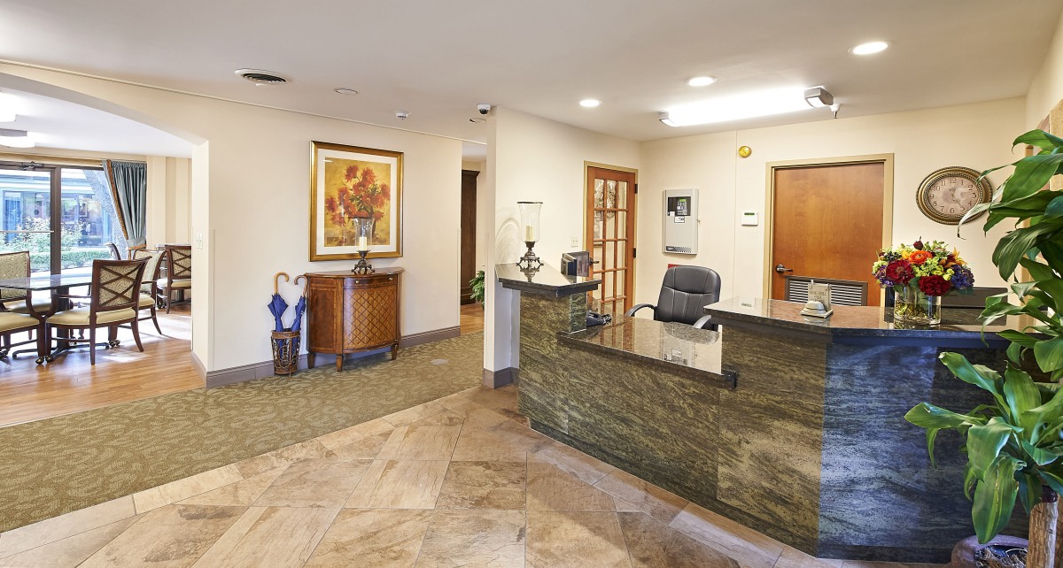 A well-lit reception area with a modern desk and stylish decor.