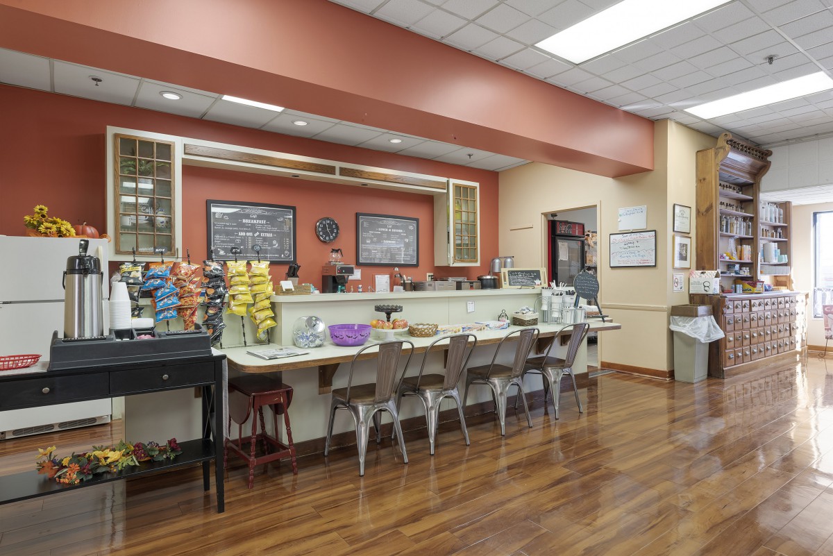 A classic diner interior featuring counter seating and menu boards.