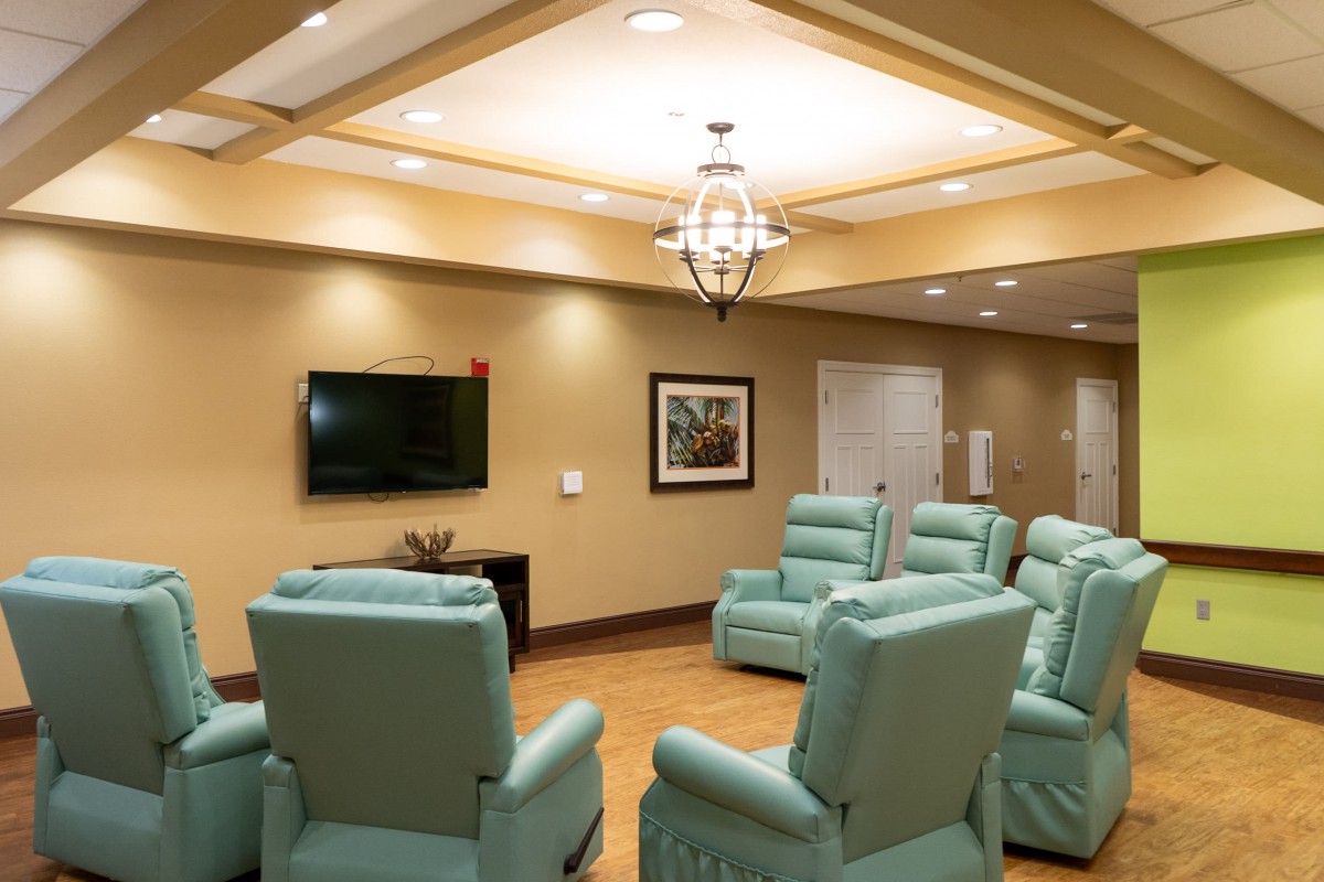 A cozy living area with recliners and a television.