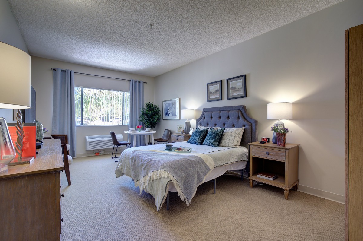 A modern and spacious bedroom with stylish decor and a comfortable bed.