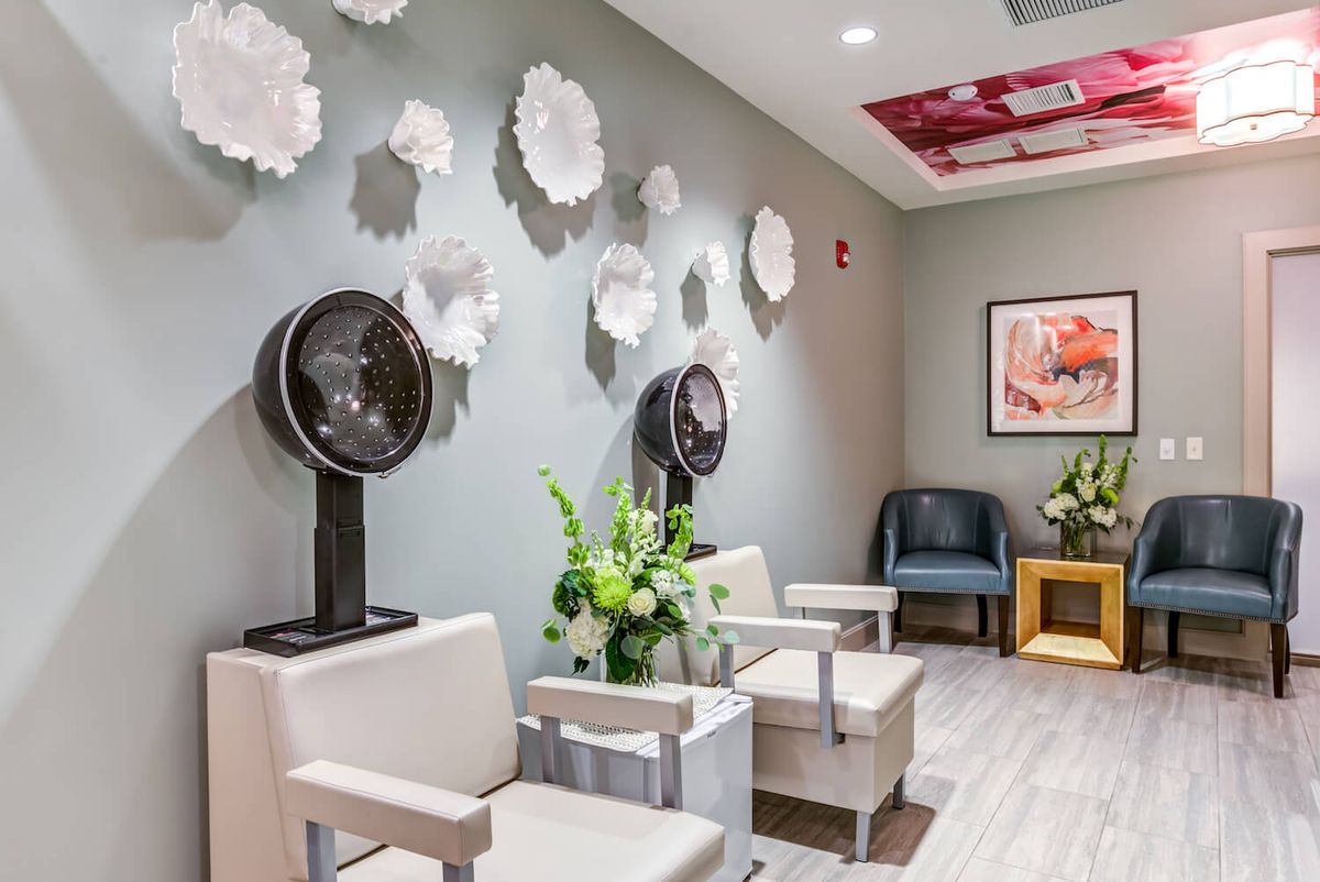 A modern salon interior with stylish decor and comfortable seating.