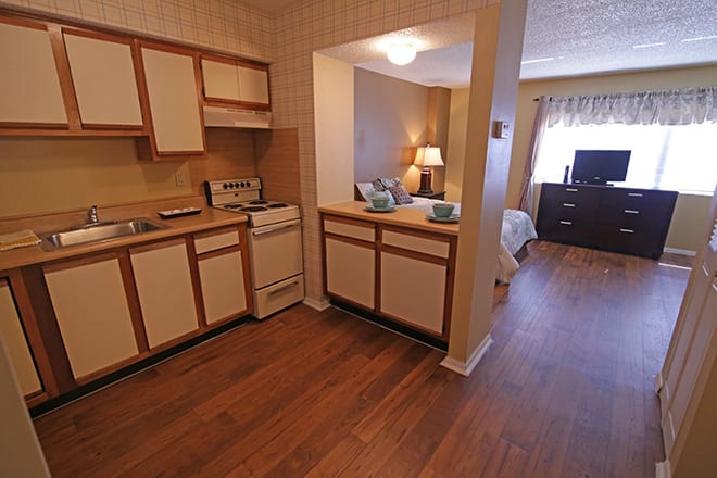 Cozy apartment with an open kitchen and living area.