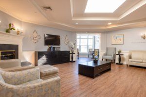 A modern living room with stylish furniture and wooden flooring.