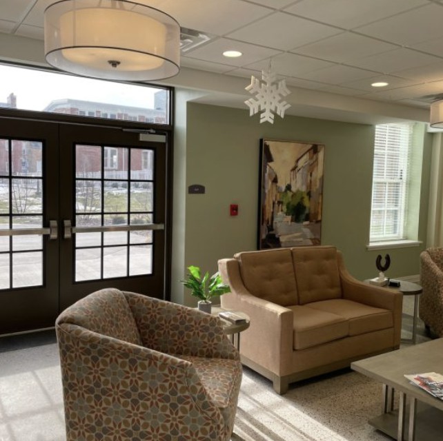 A modern lobby area featuring comfortable seating and stylish decor.