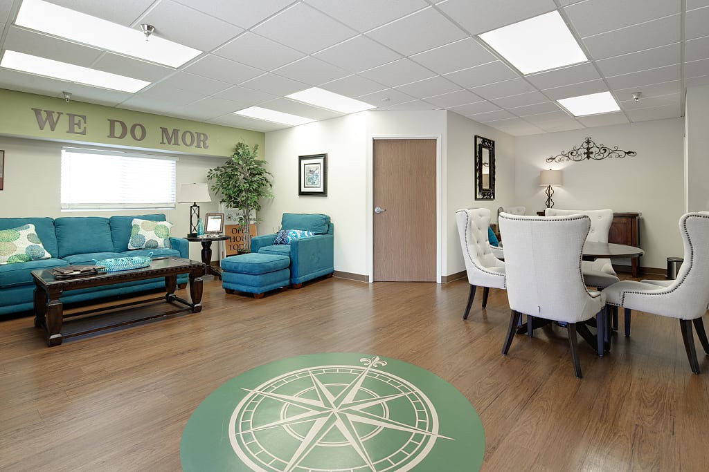A modern office lobby or waiting room with comfortable seating and stylish decor.
