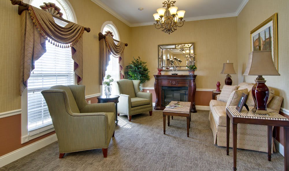 A traditional living room with elegant furnishings and decor.