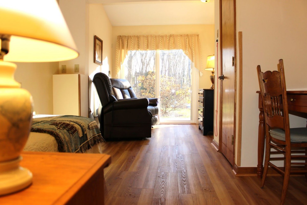 Cozy living room with hardwood floors and a bright window view.