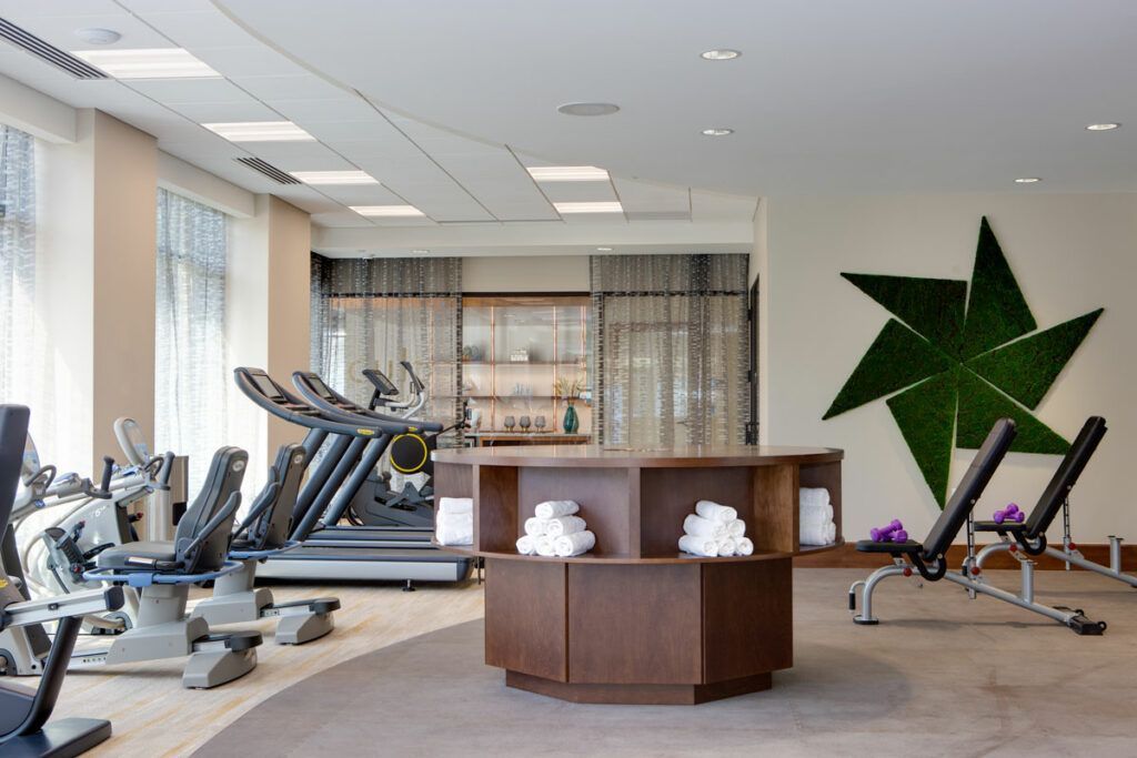 A modern and clean gym with treadmills and fitness equipment.