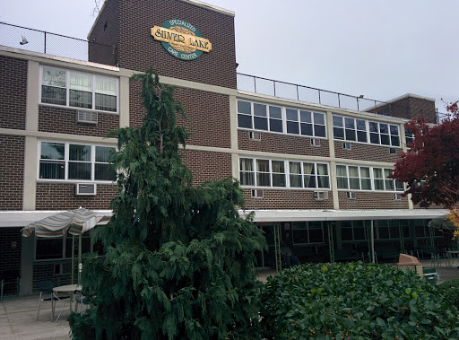 Exterior view of a restaurant building with a prominent sign.
