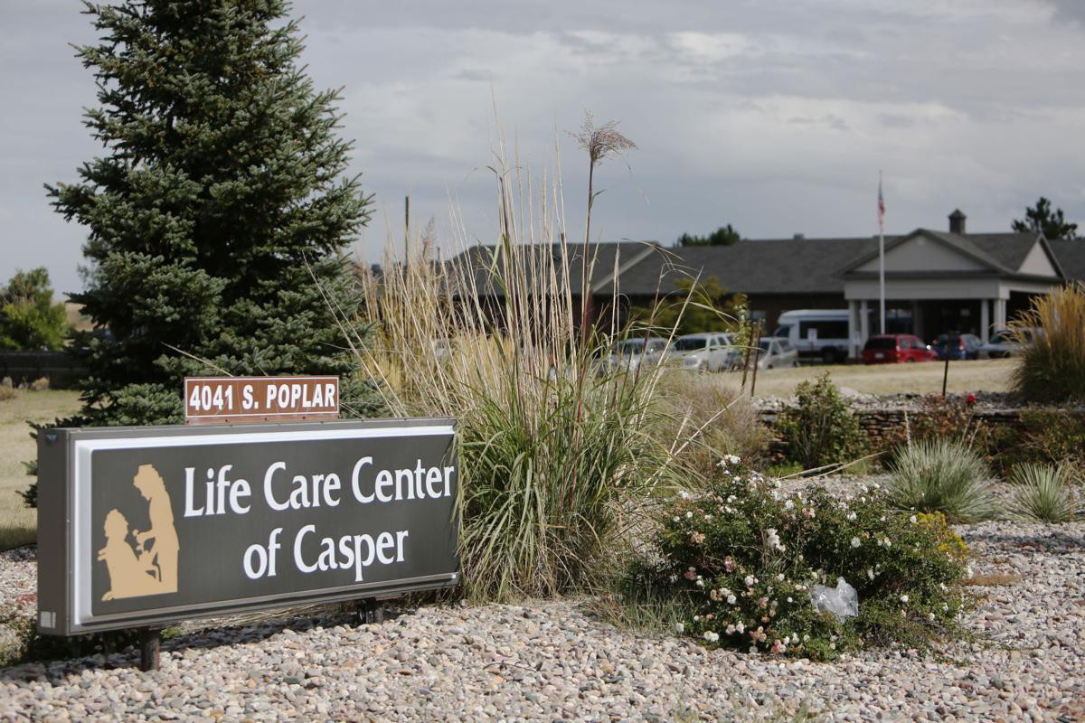 Entrance sign for Life Care Center of Casper surrounded by landscaped greenery.