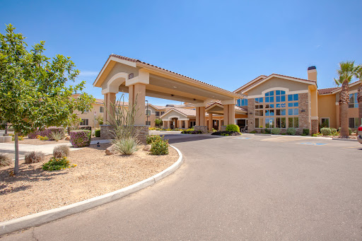 A welcoming hotel entrance with modern architecture and landscaped surroundings.