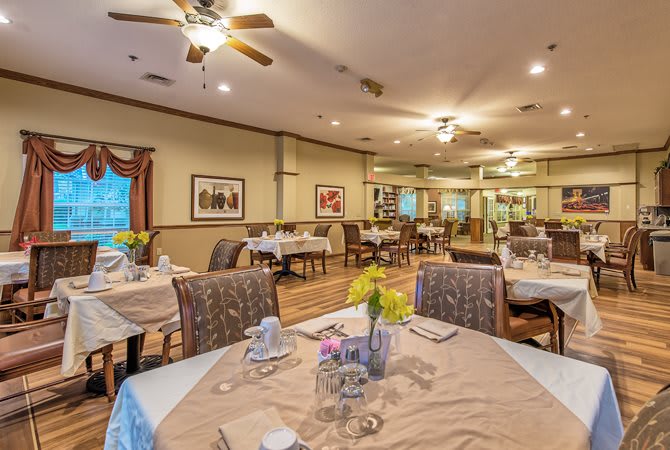 A cozy dining room with neatly arranged tables and elegant decor.