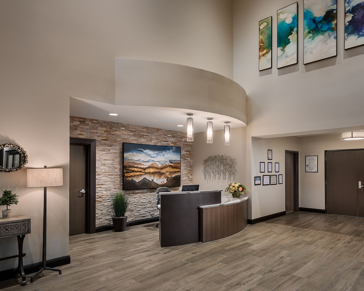 A modern and elegant reception area with stylish decor and artwork.