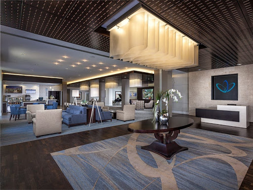A modern hotel lobby featuring elegant furnishings and stylish lighting.