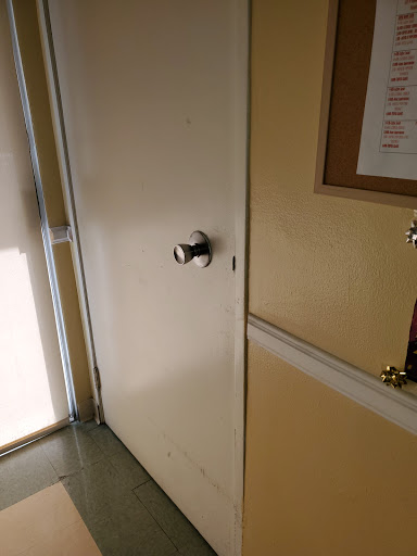 A close-up view of a door with a doorknob, showcasing the interior setting.