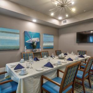 Elegant dining room with a neatly set table and modern decor.