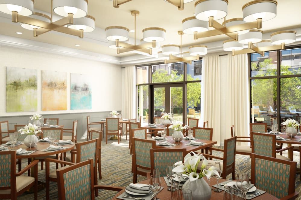 An elegantly decorated dining room with neatly arranged tables and stylish lighting.