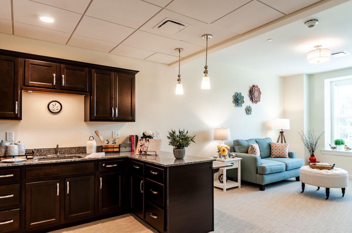 A cozy modern apartment with an open kitchen and living area.