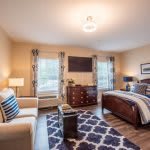 A cozy and stylish bedroom with modern furniture and decor.