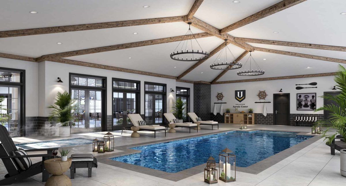 A luxurious indoor swimming pool area with lounge chairs and elegant chandeliers.