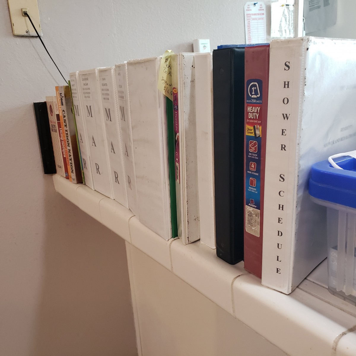 A collection of books neatly arranged on a shelf.