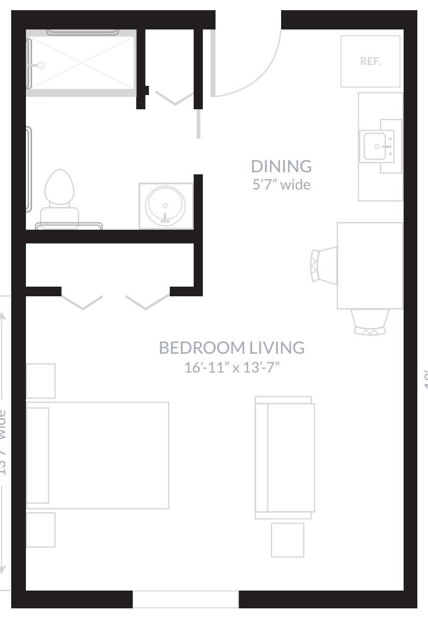 A floor plan of an apartment showing a combined bedroom and living area, dining space, and a bathroom.