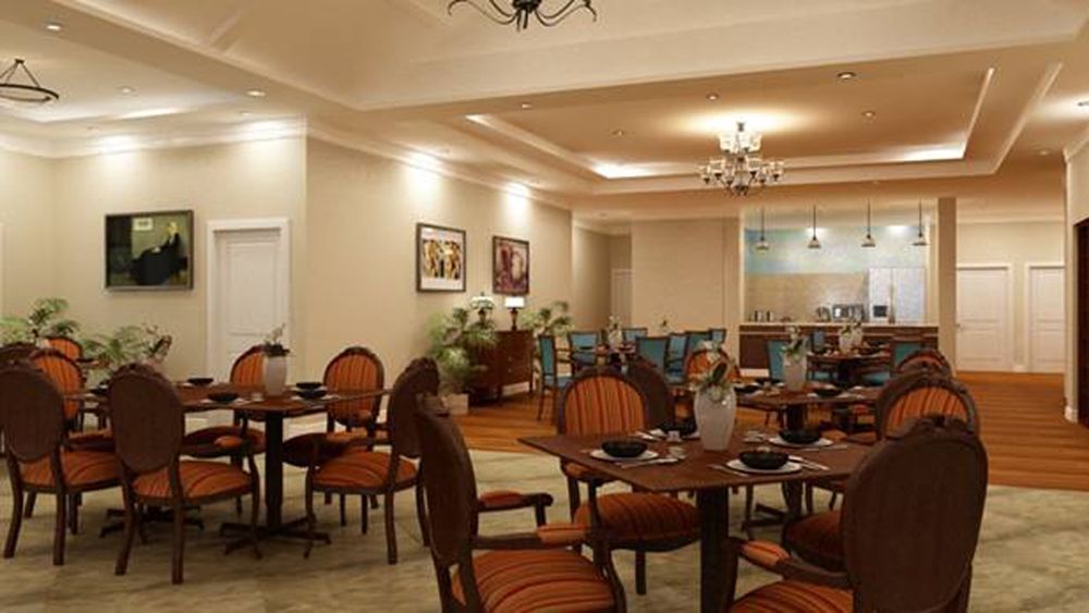 Cozy dining area with elegantly arranged tables and warm lighting.