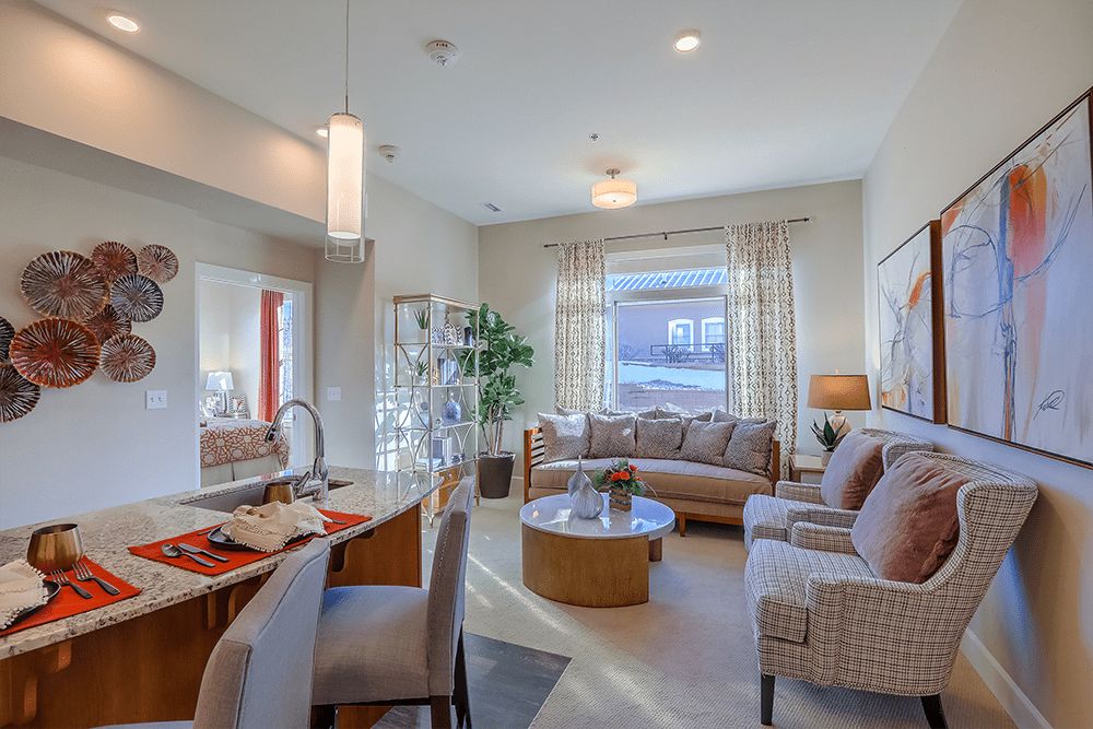 A modern living room with stylish furniture and natural lighting.