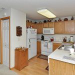 Cozy kitchen with wooden cabinets and modern appliances.